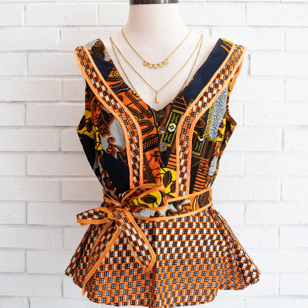 One-of-a-kind handmade kitenge blouse fashioned by refugee women in East Africa