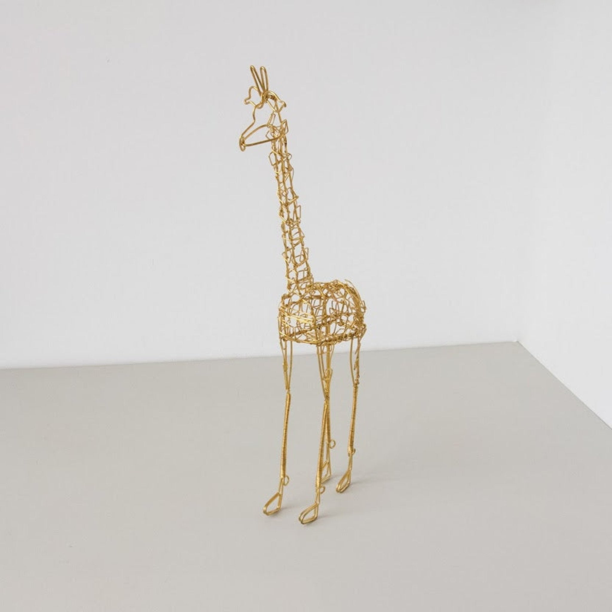 Wire Giraffe-Hand made by Kenyan artisans for a fair trade boutique.