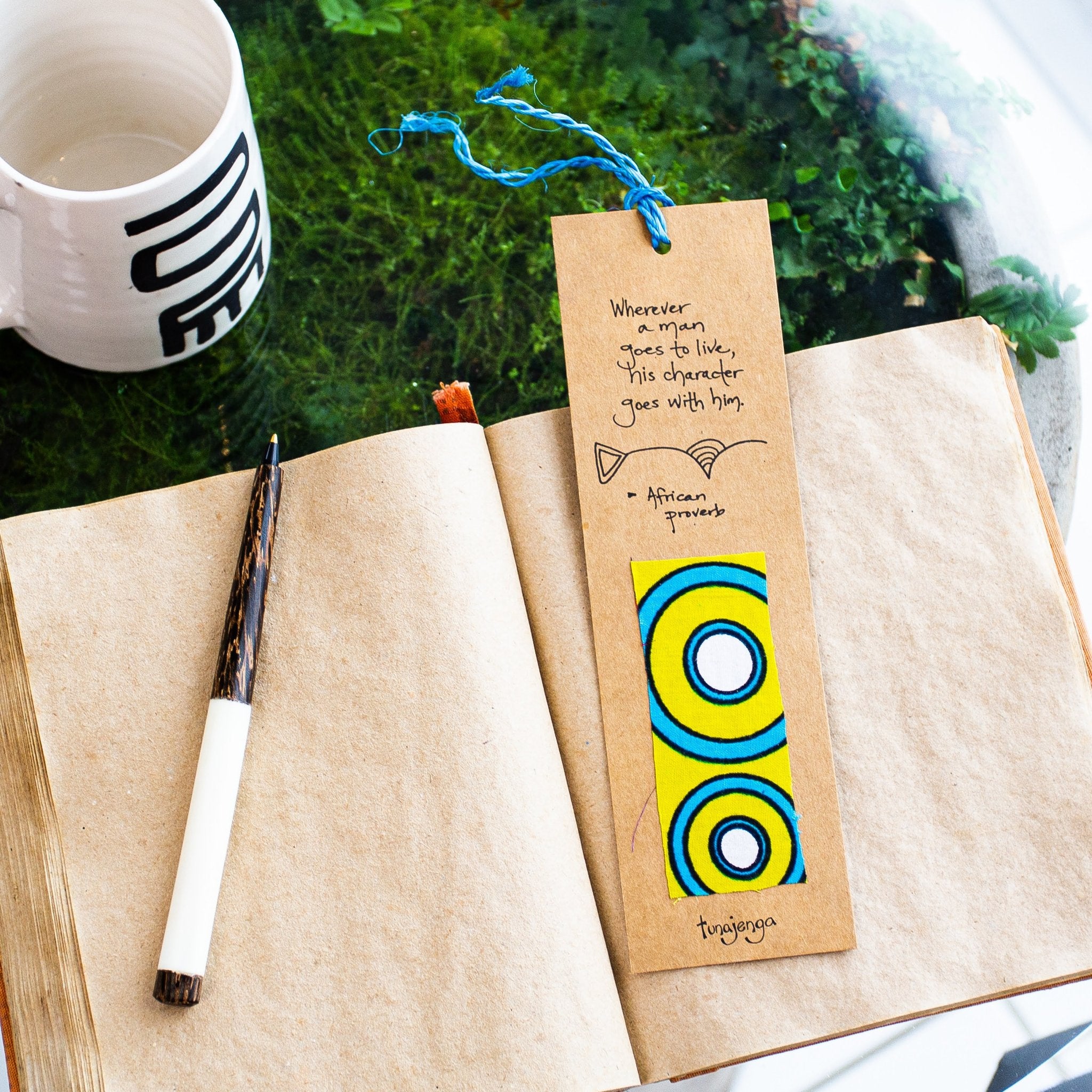 African proverb bookmark with yellow and blue details on an open book