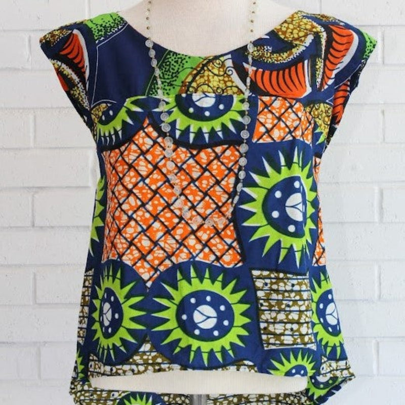 One-of-a-kind handmade kitenge blouse fashioned by refugee women in East Africa