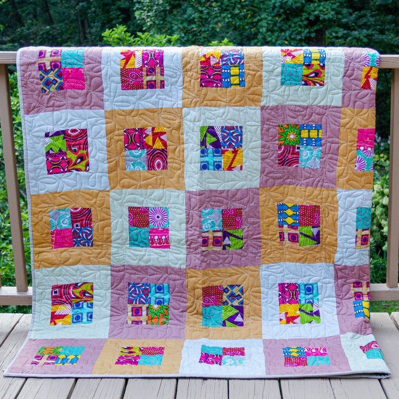 An Amani quilt - West African fabrics stitched together by the women of Amani Kenya for a Fair Trade boutique